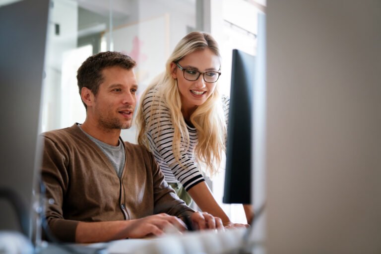cost optimisation discussions between business owners in front of the computer